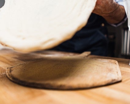 Wooden peel with semolina